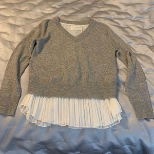 Gorgeous cashmere sweater by Brochu Walker with pleated design at waist.